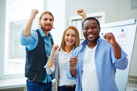 Cheerful business team expressing joy or victoryの写真素材
