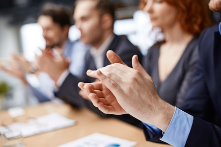 Male hands applauding at conferenceの写真素材