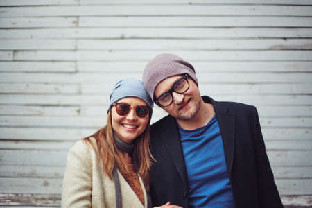 Happy young couple looking at cameraの写真素材