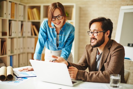 Successful businessman explaining his idea to colleague at meeting