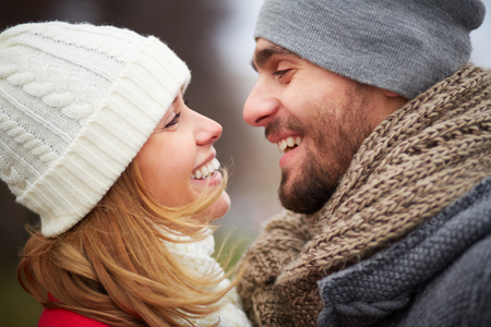 Smiling guy and girl looking at one anotherの写真素材