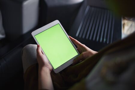 Unrecognizable person watching movie on tabletの写真素材