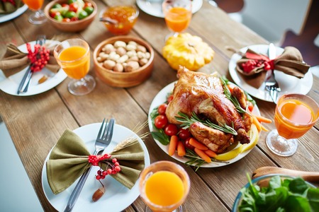 Roasted poultry and other food on Thanksgiving tableの写真素材