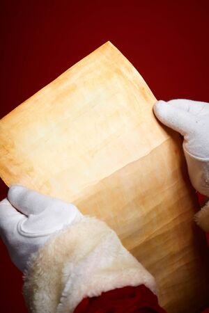 Hands of Santa Claus holding Christmas letterの写真素材