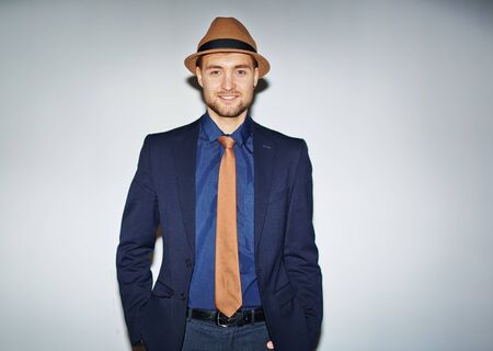 Handsome well-dressed man looking at cameraの写真素材