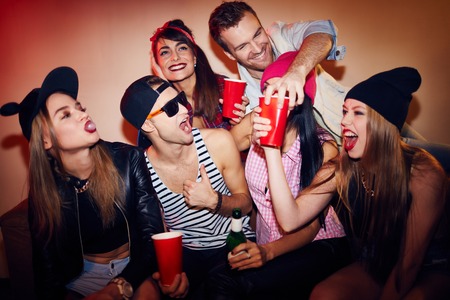 Happy teenagers having fun during a partyの写真素材