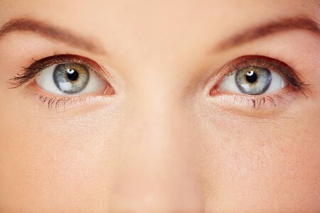 Close up of beautiful female grey eyesの写真素材