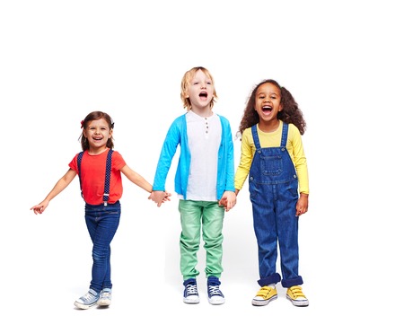 Adorable kids in casual-wear expressing joy