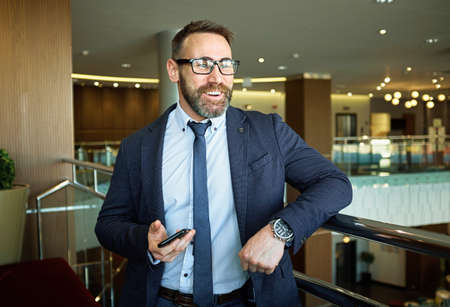 Happy businessman in formalwear and eyeglassesの写真素材