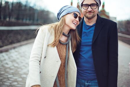 Stylish young couple having walk in the cityの写真素材