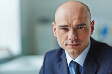 Close-up of mid adult manager looking at cameraの写真素材