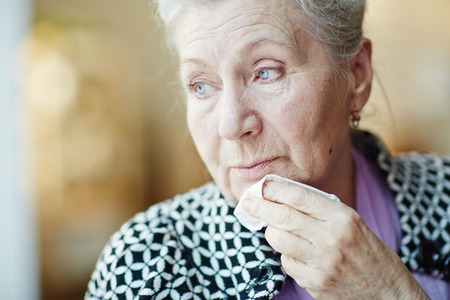Calm senior woman with handkerchief