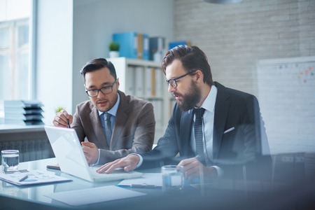 Two partners discussing terms of their partnershipの写真素材