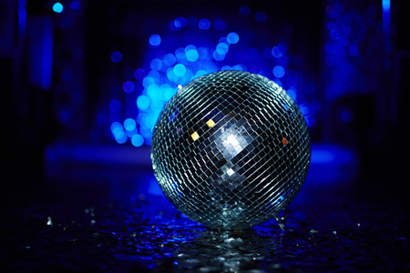 Close-up of a disco ball on dance floorの写真素材