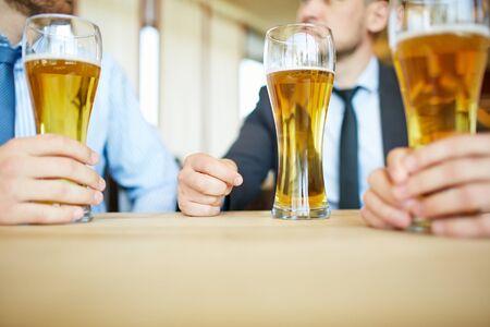 businessmen with beer spending time in barの写真素材