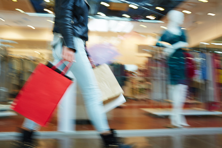 Blurred image of female in shopping mallの写真素材