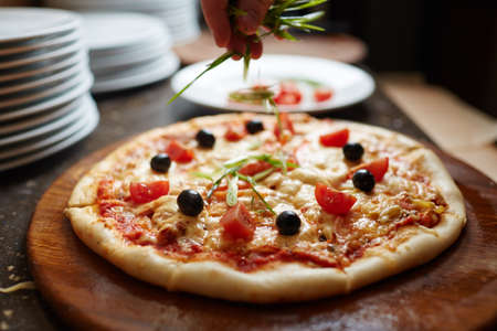 Cooked pizza served in cafeの写真素材