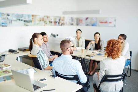 Successful managers dsicssing new business project in office