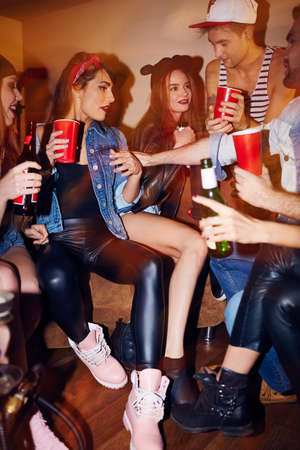 Cute friends enjoying swag party in clubの写真素材