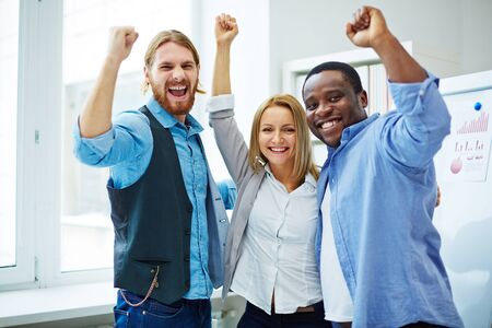 Portrait of successful business people standing at officeの写真素材