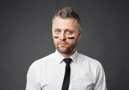 Portrait of confident businessman isolated on black backgroundの写真素材
