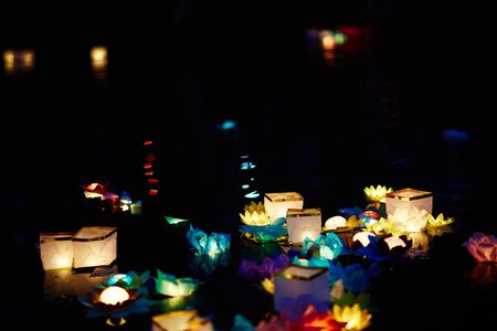 Festival of water lanterns in park at nightの写真素材
