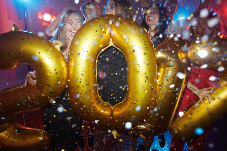 Group of ecstatic friends celebrating new yearの写真素材