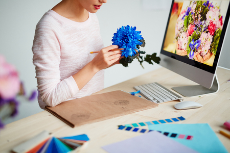 Woman drawing flower for graphic designの写真素材