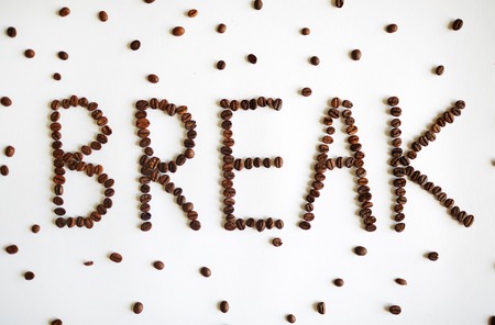 Coffee seeds shaping a break wordの写真素材