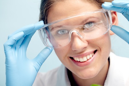 Female scientist smiling and looking at cameraの写真素材