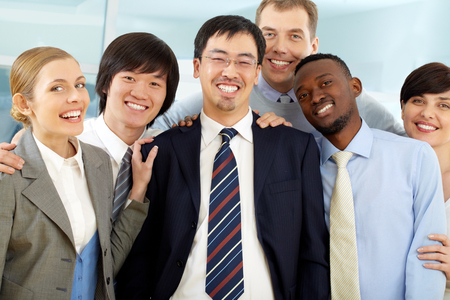 Group of happy business people looking at cameraの写真素材