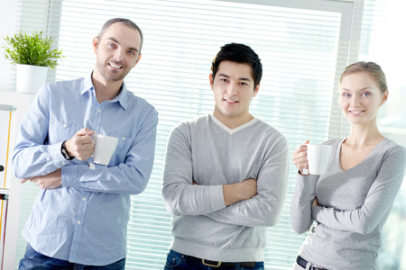 Portrait of young business team looking at camera and smilingの写真素材