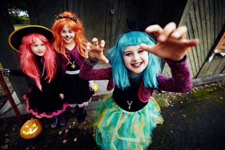 Cute girl in blue wig frightens peopleの写真素材