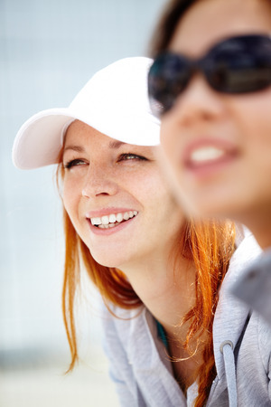 Selective focus of a ginger girl looking awayの写真素材
