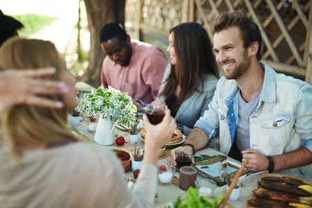 Thanksgiving hang-out of young friendly peopleの写真素材