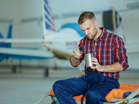 Repairman having lunch in the middle of working dayの写真素材