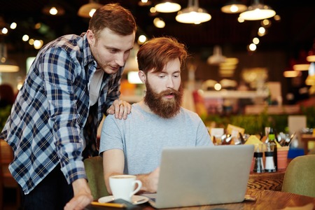 Creative guys searching for data in the netの写真素材