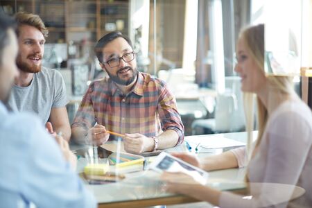 Group of entrepreneurs discussing cooperation terms at meetingの写真素材