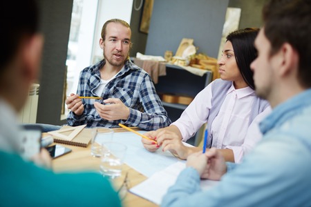 Creative people discussing new ideas or art project