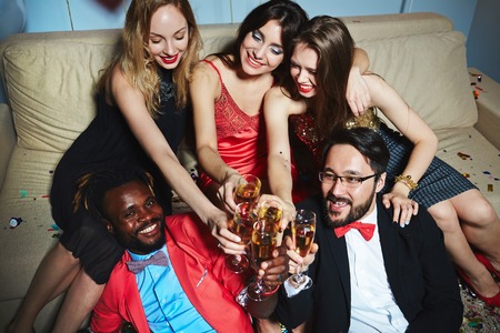Cheerful young people enjoying party or boozeの写真素材