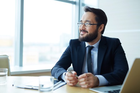 Handsome Asian businessman working in officeの写真素材