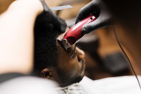Head of young man during haircutの写真素材