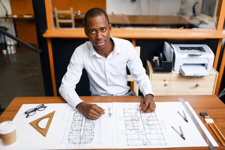 Engineering professional looking at camera during workの写真素材