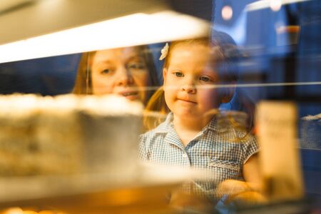 Girl by display-standの写真素材