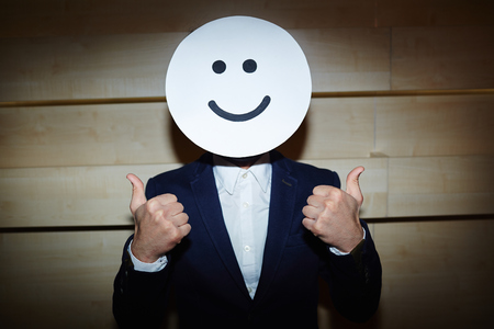 Successful Businessman in Smiling Maskの写真素材