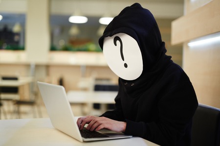 Anonymous hacker at workの写真素材