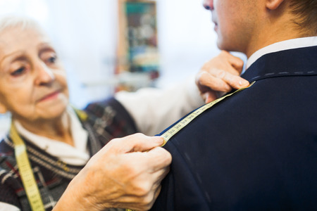 Measuring length of jacket shoulderの写真素材