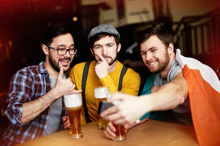 Men Fooling for Selfie Shotの写真素材