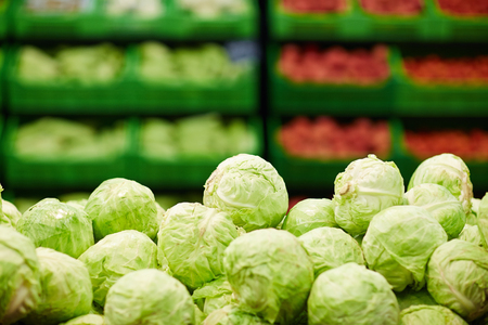 Fresh green cabbages in supermarketの写真素材