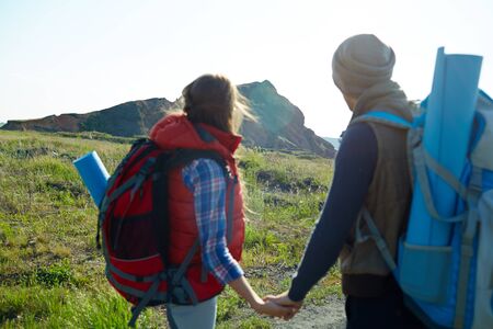 Tourists Walking to Mountain